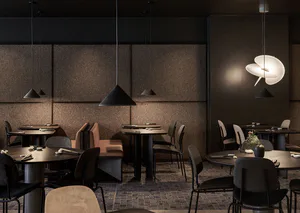 Modern dark-toned restaurant interior with round and square dining tables, upholstered chairs, textured brown walls, and contemporary pendant lights including a sculptural white chandelier.