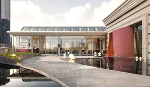 Modern luxury restaurant entrance featuring a large reflecting pool, curved travertine paving, spherical outdoor lights, and a bold red curved accent wall under a glass canopy.