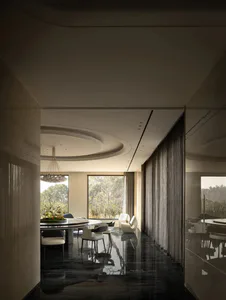 Modern luxury dining room featuring glossy black marble floors, a large round dining table, sculptural white and black dining chairs, a statement chandelier, and floor-to-ceiling windows with views of trees.